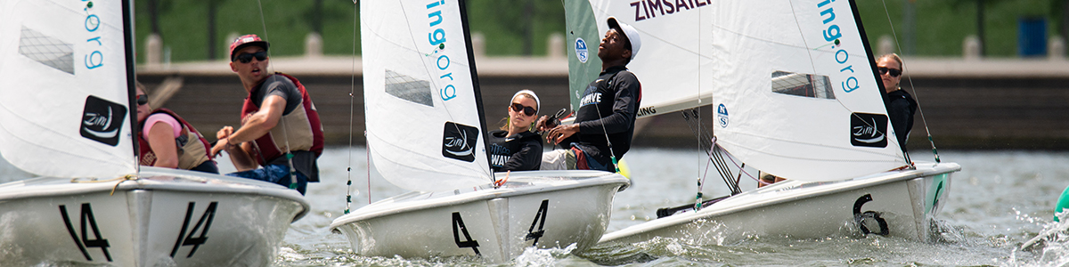 LaserPerformance Team Racing Nationals in St. Petersburg teams racing in front of umpire boat